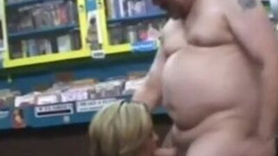Woman Randomly Sucks a Dirty Video Store Clerk