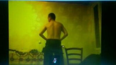 A guy is doing a striptease)