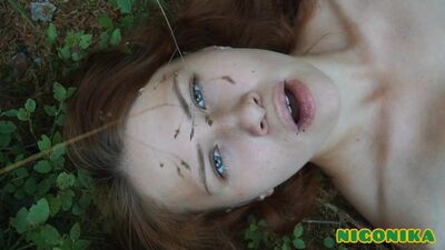 Pretty woman picking blueberries