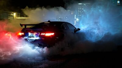 BMW azul a queimar borracha - fundo de ecrã animado para o Wallpaper Engine